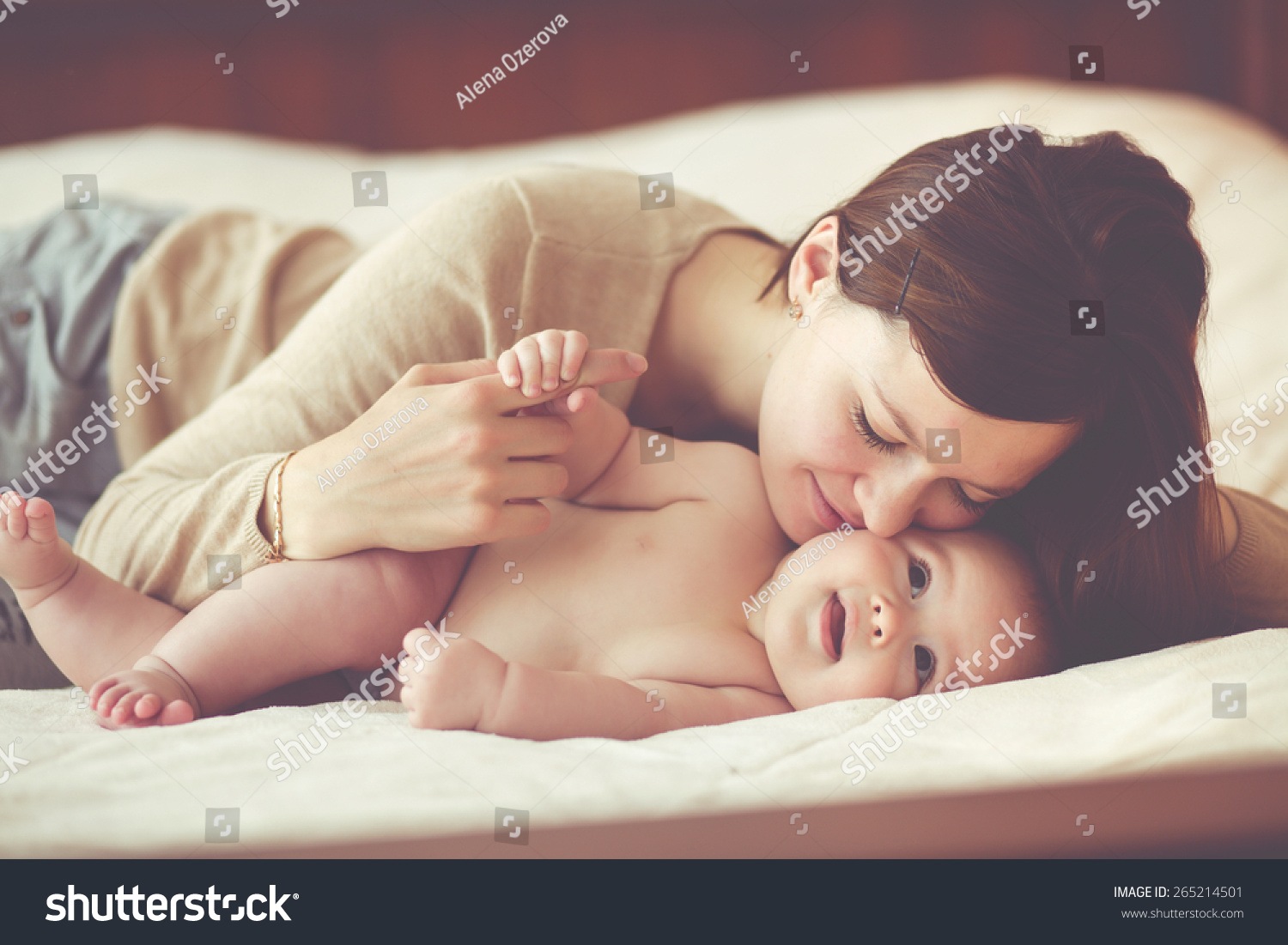 stock-photo-portrait-of-a-mother-with-her-months-old-baby-265214501.jpg